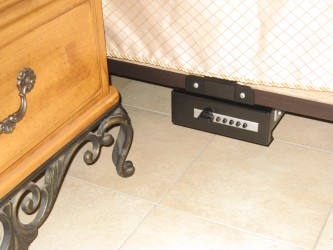 TITAN Gun Vault bolted to bed frame.