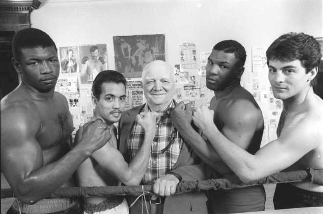Cus D'Amato with Mike Tyson and other students.