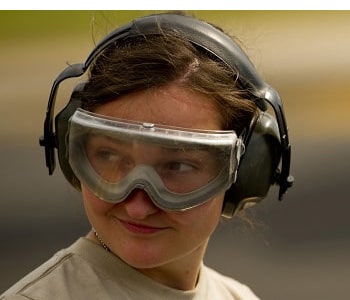 A woman wearing ear protection.