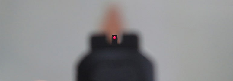 A good sight picture. The front sight is centered in the rear sight window, is horizontally level with the rear sight, and is in focus.