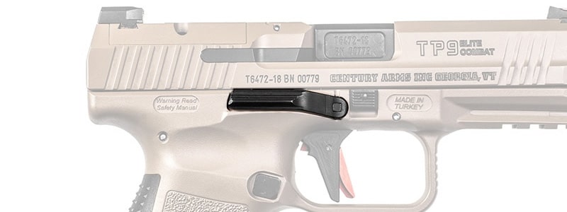 A pistol slide stop with generous width.