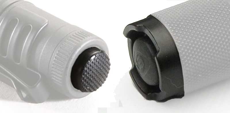 Tailcap switches. On the left is an exposed switch, and on the right is a shrouded switch.